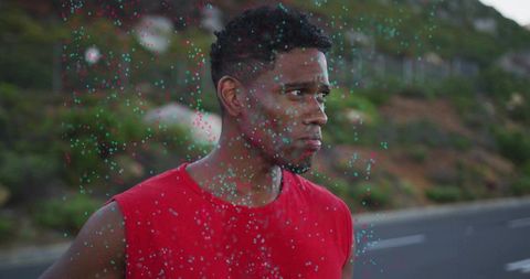 Determined male adventurer in scenic mountain landscape