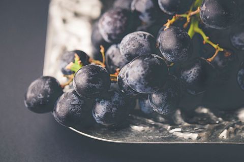 Close-up of Fresh Black Grapes on Metal Tray