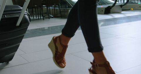 Woman Walking with Luggage in Modern Office Corridor - Download Free Stock Images Pikwizard.com