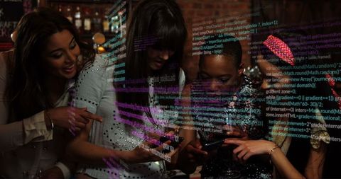 Diverse women engage in tech and social interfaces over drinks