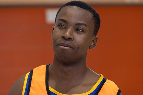 Athletic determination young sporty male observing gym surroundings