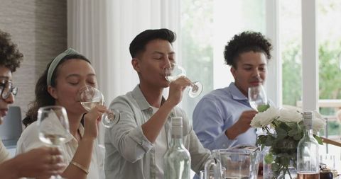 Friends Enjoying Drinks at Festive Wedding Reception