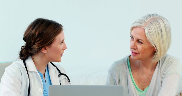 Young Female Doctor Consulting Senior Patient in Clinic - Download Free Stock Images Pikwizard.com