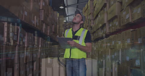 A man wearing a high-visibility green vest controls inventory while holding a clipboard, digitally marked with data overlays illustrating modern logistics and distribution concepts. Use this to depict warehouse management systems, technological advancement in inventory management, or logistics solutions.
