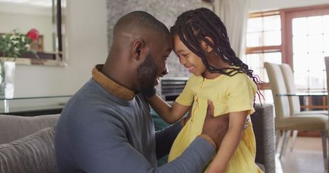 Father and Daughter Sharing Tender Moments at Home