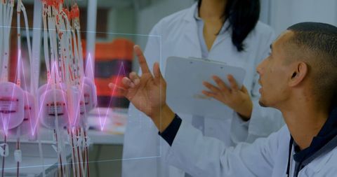 Doctors analyzing holographic medical data