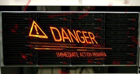 Digital warning sign in server room highlighting cybersecurity risks