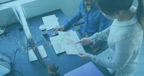 Corporate team collaborating on analytical data at modern workspace