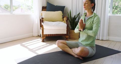 Woman Practicing Mindfulness Meditation at Home in Serenity