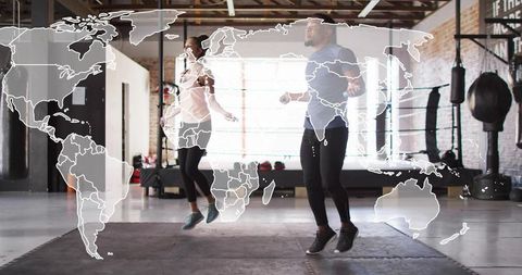 Dynamic jump rope duo training cardio and coordination in boxing gym with map overlay