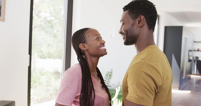 Happy African American couple smiling at home - Download Free Stock Images Pikwizard.com
