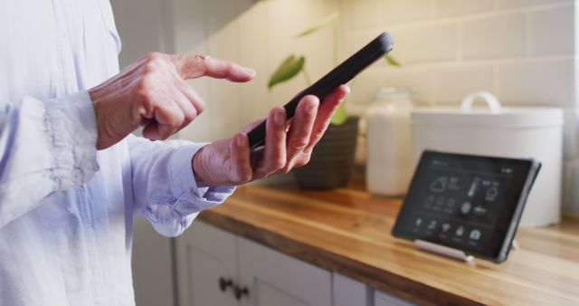 Senior Adult Using Smartphone in Modern Kitchen Interior - Download Free Stock Images Pikwizard.com