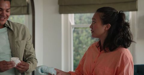 Couple embracing pregnancy journey at home in relaxation