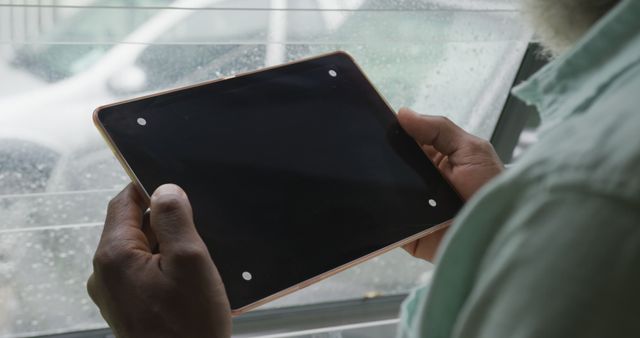 Image of african american senior man using tablet with black screen - Download Free Stock Photos Pikwizard.com