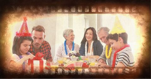 Multigenerational Family Celebrating Birthday with Cake and Gifts