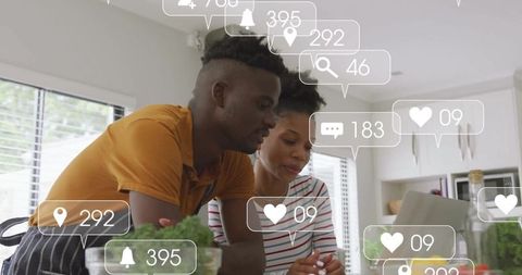 Couple Engaged with Social Media in Modern Kitchen