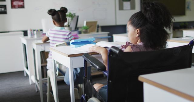 Young African American Girl in Wheelchair Studying in Classroom - Download Free Stock Images Pikwizard.com