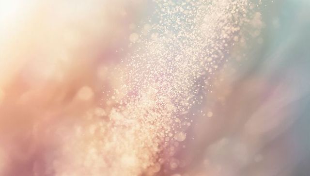 Dreamy pastel particles flowing diagonal bokeh background with glittery light rays