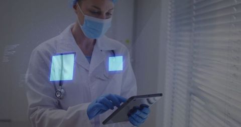 Female Doctor Tapping Tablet Using Telemedicine Interface with Holographic UI