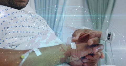 African american man in hospital with network overlay illustrating modern healthcare