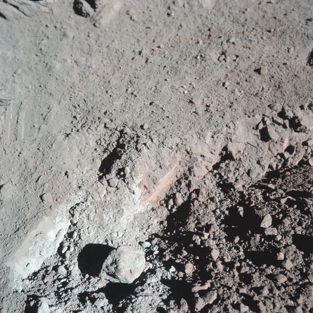AS17-137-20989 (12 Dec. 1972) --- A close-up view of the much-publicized orange soil which the Apollo 17 crewmen found at Station 4 (Shorty Crater) during the second Apollo 17 extravehicular activity (EVA) at the Taurus-Littrow landing site. The orange soil was first spotted by scientist-astronaut Harrison H. Schmitt. While astronauts Schmitt and Eugene A. Cernan descended in the Lunar Module (LM) "Challenger" to explore the lunar surface, astronaut Ronald E. Evans remained with the Apollo 17 Command and Service Modules (CSM) in lunar orbit. The orange soil was never seen by the crewmen of the other lunar landing missions - Apollo 11 (Sea of Tranquility); Apollo 12 (Ocean of Storms); Apollo 14 (Fra Mauro); Apollo 15 (Hadley-Apennines); and Apollo 16 (Descartes).
