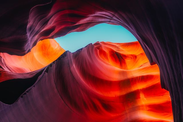 Vibrant Sandstone Curves of Antelope Canyon under Blue Sky - Download Free Stock Photos Pikwizard.com