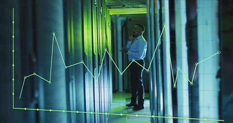 IT Engineer Monitoring Servers with Overlaid Data Graph - Download Free Stock Images Pikwizard.com