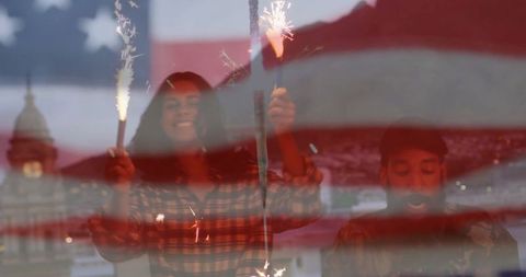 Friends Celebrating with Sparklers Under US Flag Overlay