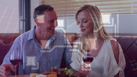 Caucasian Couple Enjoying Dinner with Digital Overlay