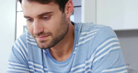 Man Preparing Meal in Modern Kitchen