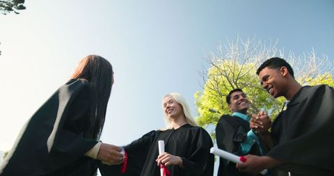 Diverse Group Celebrating Graduation with Joy and Smiles