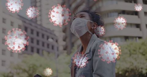 Woman with mask outdoors surrounded by digital virus graphics