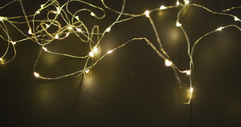 Warm Glow Fairy Lights on Dark Background for Festive Atmosphere