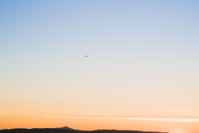 Airplane Flying Over Scenic Sunset Landscape - Download Free Stock Photos Pikwizard.com
