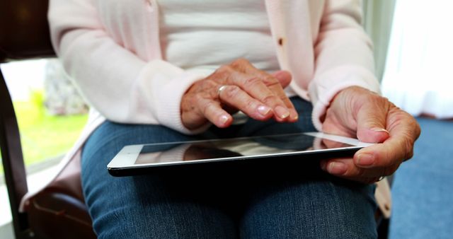 Close-Up of Senior Woman Using Digital Tablet at Home - Download Free Stock Images Pikwizard.com