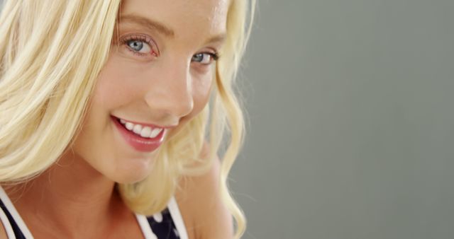 Close-Up Portrait of Smiling Young Blonde Woman with Blue Eyes - Download Free Stock Images Pikwizard.com