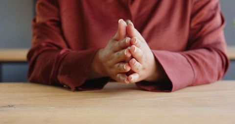Businesswoman Tapping on Desk for Enhanced Concentration