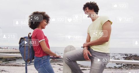 Young Couple on Versatile Getaway with Social Media Engagement Icons