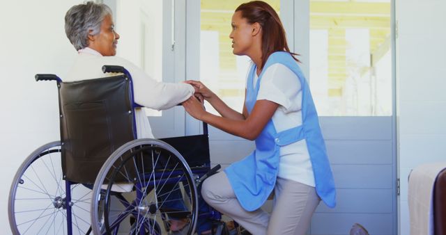 Caregiver supports elderly patient in wheelchair in healthcare setting. Perfect for illustrating nursing care, elder assistance, healthcare services, promotional material for clinics and nursing homes, elderly care blogs.