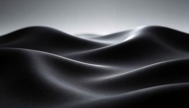 Velvety Black Fabric Waves Flowing with Soft Rim Highlights and Minimalist Texture