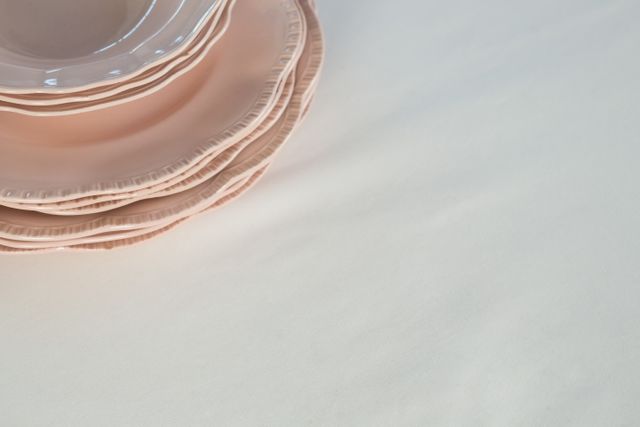 Close-up of plates set elegantly on a table