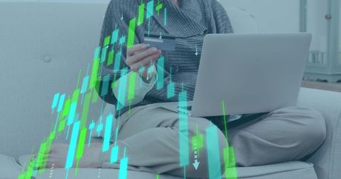 Woman online shopping with credit card and laptop