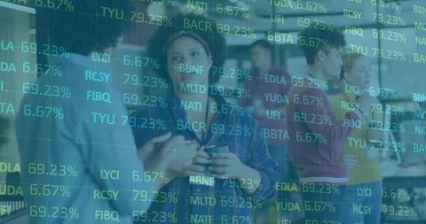 Office team analyzing stock trends with digital data overlay