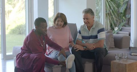 Home Medical Consultation: Doctor Examines Senior Couple