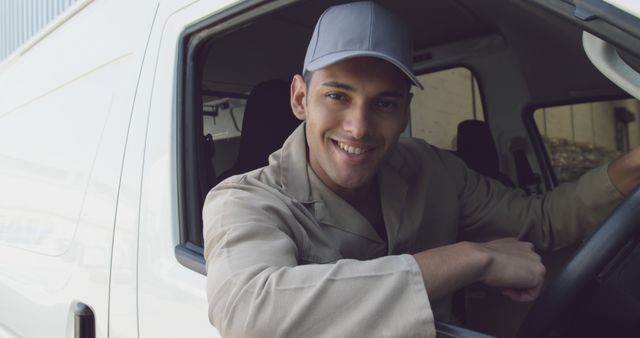 Smiling Delivery Driver Sitting in Vehicle - Download Free Stock Images Pikwizard.com