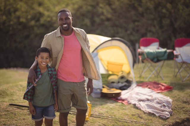 Smiling Father and Son Enjoying Camping Trip - Download Free Stock Photos Pikwizard.com