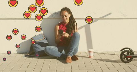 Woman Relaxing on Street with Smartphone and Heart Icons