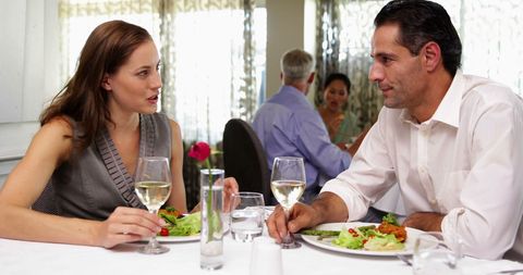 Couple Enjoying Romantic Dinner at Elegant Restaurant Setting - Download Free Stock Images Pikwizard.com