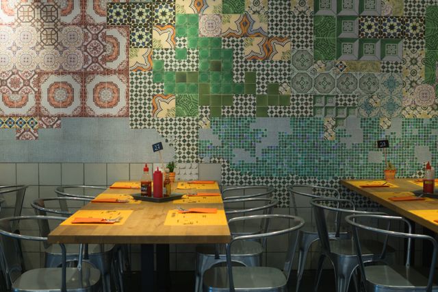Modern cafe featuring colorful mosaic tile wall and industrial furniture, with neatly arranged tables and vibrant tableware. It is ideal for content about interior decor inspiration, contemporary dining spaces, or showcasing casual dining experiences.