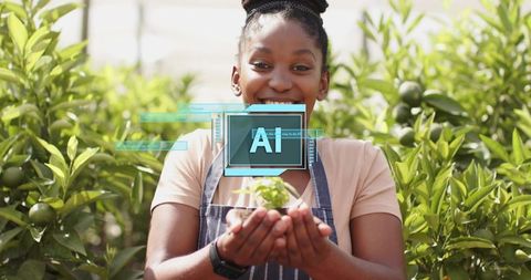 Woman holding seedling in citrus garden reflecting sustainability